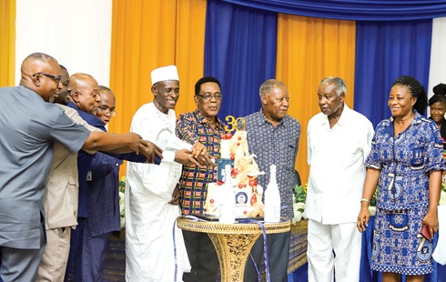 Dr Abubakari Sidick Ahmed (middle), Station Manager, Radio Univers, Yaw Boadu-Ayeboafo (4th from left), Chairman, NMC, Prof. Kwesi Yankah (4th from right), Albert Dwumfour (2nd from left), President, GJA, and other guests cutting the 30th anniversary launch cake. Picture: CALEB VANDERPUYE 