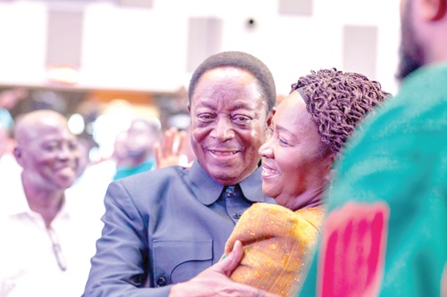 Dr Kwabena Duffuor (left) embracing Prof. Naana Jane Opoku-Agyemang at her ‘outdooring’ ceremony