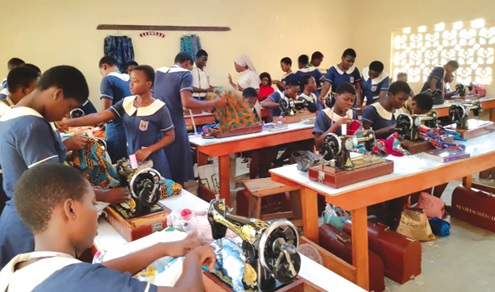 Reverend Sister Jusinta Kwakyewaa Osei (arrowed) engaging with some of the students at the new Clothing and Textiles Resource Centre