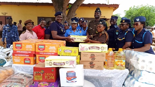 Rachel Jacintha Pyne,(4th left) President of Tema Customs Ladies handing over the items to ADP Joyce Annor-Owusu, the officer in charge of the Female section of Akuse Local Prison. Pix Benjamin Xornam Glover