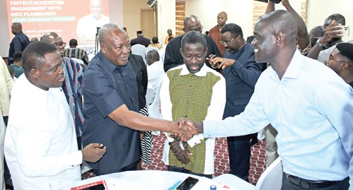 John Mahama (2nd from left), flag bearer of the NDC, interacting with some Fintech stakeholders after the meeting. Picture: ERNEST KODZI