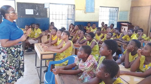 Akosua Danquah Ntim-Sekyere, Team Lead of the See something, say something campaign, speaking to pupils of the Calvary 1 and 2 basic school in Adabraka