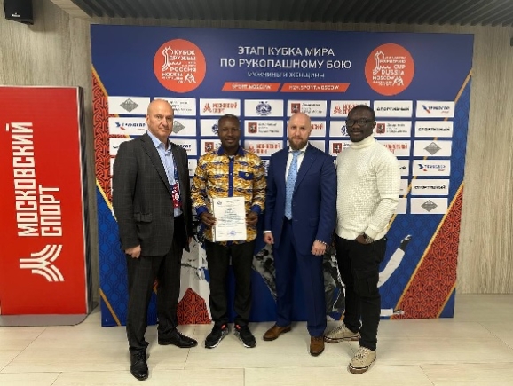  John Aggrey (with certificate) and other members of the international body at the Friendship Cup 2024, Russia