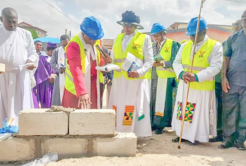 Right Reverend Emmanuel Borlabi Bortey (2nd from left), Bishop of the Accra Diocese of the Methodist Church Ghana, laying the foundation stone for the church building of Good News Methodist Church. Looking on are the Very Reverend Doris Saah, Synod Secretary of the Accra Diocese, and the Very Reverend Bennett Ato Wilson (holding the Bishop’s staff), the Superintendent Minister of the Kaneshie North Circuit. On the extreme left is Rev. Emmanuel Ayesu-Danso, the Minister in charge of Good News
