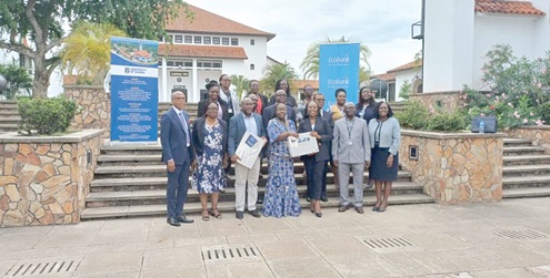 Abena Osei-Poku (3rd from right), MD, Ecobank Ghana, handing over a laptop to Prof. Nana Aba Appiah Amfo (4th from left), Vice-Chancellor, UG. With them are staff and executives of the university and the bank