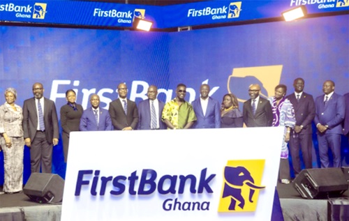 Sarkodie (6th from right) flanked by Dr Amin Adam (5th from right), Finance Minister, Dr Ernest Addison, BoG Governor, FirstBank Group and Ghana executives