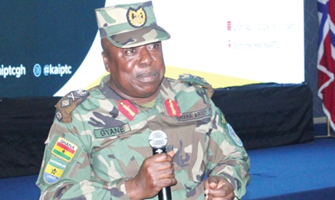Major General Richard Addo-Gyane (inset), the Commandant of KAIPTC, delivering his address at the launch of the five-year strategic plan