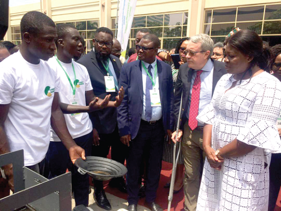 Ophelia Mensah Hayford (right), Minister of MESTI; Robert R. Taliercio, the World Bank Ghana Country Director; John Kingsley Krugu, Executive Director of the EPA; engaging with some exhibitors of a mercury-free minding equipment during the conference.