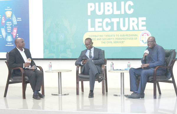 Dr Kwaku Danso (right), Ag Dean of the Faculty of Academic Affairs and Research, KAIPTC, in a panel discussion with Dr Albert Antwi Boasiako (middle), Director General, Cyber Security Authority. Moderating is Prof. Godfred Bokpin (left), Economist. Picture: ERNEST KODZI