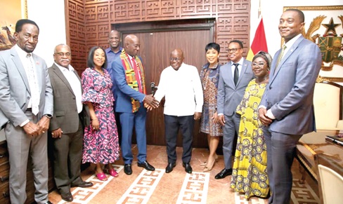 President Akufo-Addo (middle) in a handshake with Dr Keith Christopher Rowley (4th from left), Prime Minister of Trinidad and Tobago, at the Jubilee House. With them are some Government officials. Picture: Samuel Tei Adano