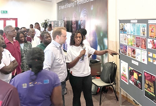 Millicent Mensah-Torkornoo (right), a trainee, explaining a point to Andreas Berding (2nd from right), Head of Centre, Ghanaian-European Centre; Charles Acquah-Moses (3rd from right), Managing Director, YAMES Contract Works, and other participants during an exhibition by the trainees. Picture: EDNA SALVO-KOTEY