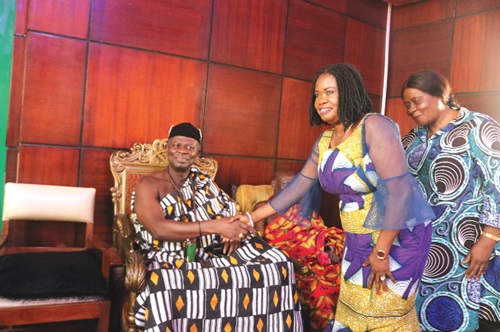 Joyce Adjoa Agyeiwaa (right) shaking hands with Paramount Chief of Assin Kotoku, Oseadeeyo Dr Frimpong Manso IV, during the courtesy call on him at his palace in Oda
