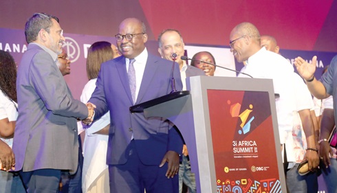 Dr Ernest Addison (2nd from left), Governor of the Bank of Ghana, shaking hands with Ravi Menon (left), Singapore Ambassador for Climate Change Action and Senior Advisor, National Climate Change Secretariat, at the event. With them is Kwamina Duker (right), CEO, Development Bank, Ghana. Picture: SAMUEL TEI ADANO