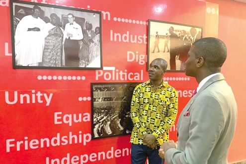 Dickon Mitchell (right), Prime Minister of Grenada, viewing some historic pictures of Dr Nkrumah on display at the musuem