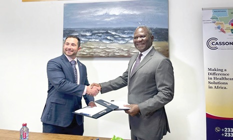 John Chigbu (right), CEO, Cassona Global Imaging, and Stanley Sonkin, Project Manager of Medical Scientific, exchanging the signed agreement