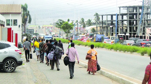 People walking home on the Graphic Road in Accra. Picture: ESTHER ADJORKOR ADJEI