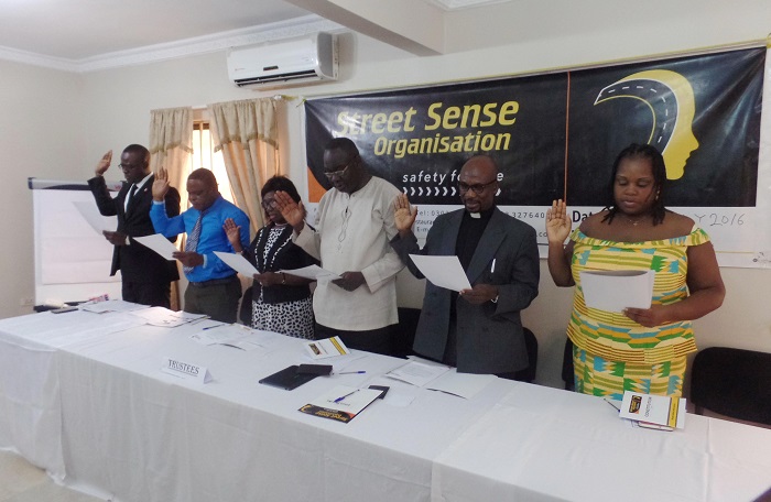 The trustees swearing an oath. 