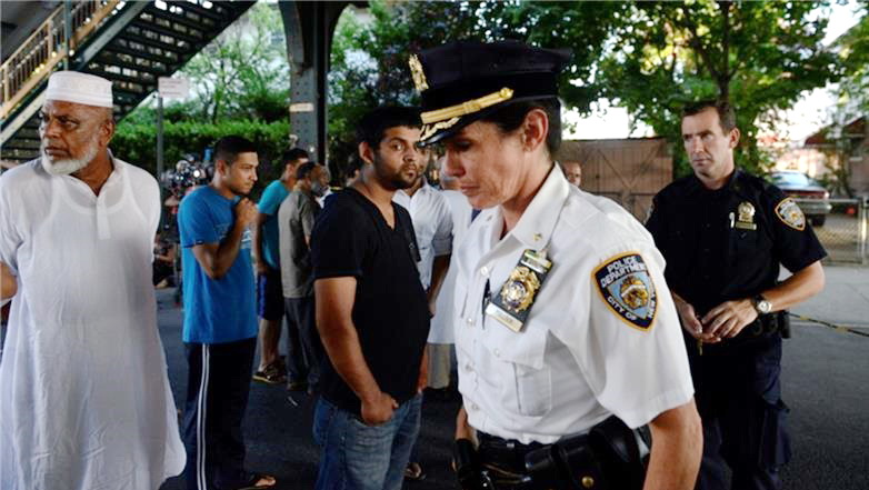 Local Bangladeshi community members held a rally after the shooting [Stephanie Keith/Reuters]