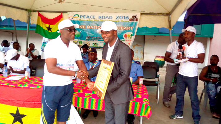  Mr Teye Doku (left) receiving the symbol of office on behalf of the minister from Tegha King of the UFP