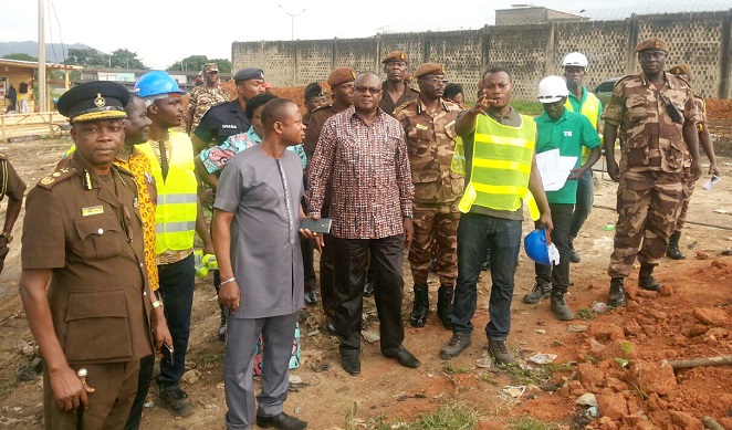 Mr Joshua Azure explaining a point to Mr Prosper Bani (middle) and other members of the team.