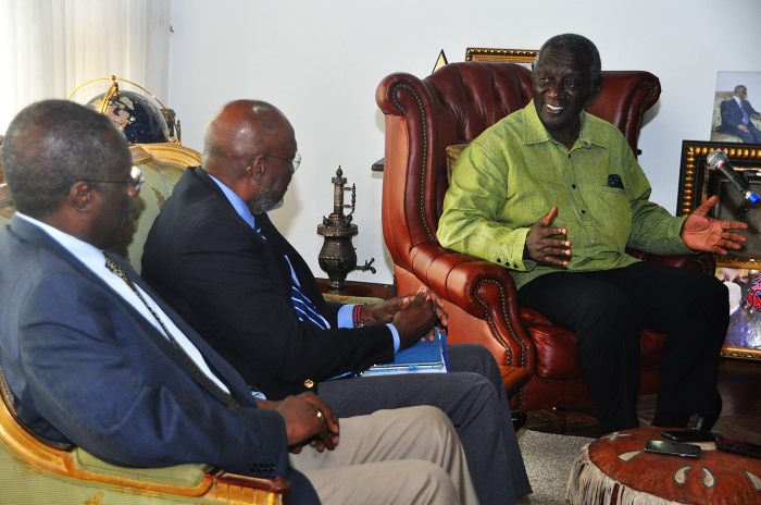  Former President Kufuor (right) explaining a point to  Mr Johnny Carson. Picture: SAMUEL TEI ADANO