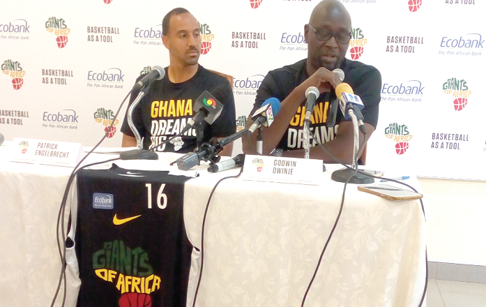  Mr Owinje (with mic) addressing the media