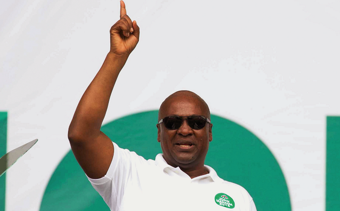  President John Mahama addressing the NDC gathering (below) at the Cape Coast Stadium 