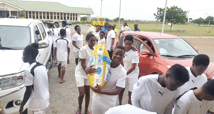 Some of the Maidens carrying the items to their camp