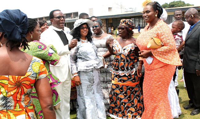 Pastor Daniel Sackey (3rd left), Resident Pastor of Pentecost International Worship Centre (PIWC), and his wife, Mrs Mary Sackey (4th left), interacting with some church members after  the farewell service. Picture: EDNA ADU-SERWAA