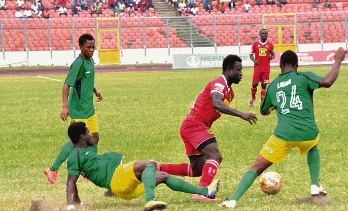 Kotoko’s Kwame Boateng (left) battles with Wahab Adam of Aduana Stars for the ball. Picture EMMANUEL BAAH