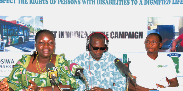   Madam Rita Kyeremaa Kusi (left), Executive Director, Ghana Federation of disability (GFD), briefing journalists at  a press conference on the state of implementation of the UN conventions of the rights of persons with disabilities (CRPD). With her are Mr Alexander Bankole Williams (2nd right), a member of  the Ghana Federation of disability Communication Team, and Mr Moses Fordjour (right) the monitoring and evaluation officer (GFD) in Ghana. Pictures: GLADYS ATTA BOATENG.