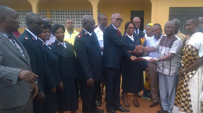 Nana Amoah Gyasi (right), the Agona Adontenhene, presenting the land documents to the Territorial Commander of the Salvation Army Church, Col Joseph Lukau 