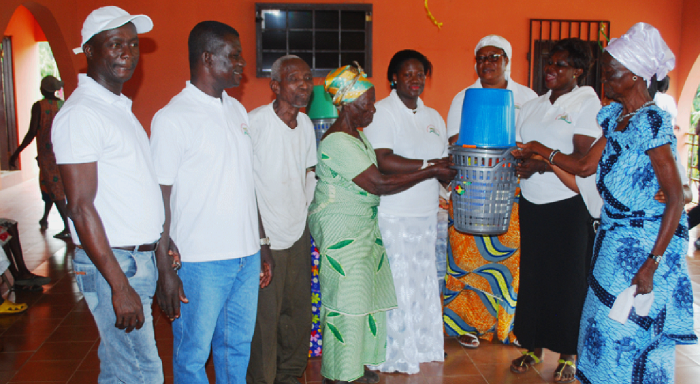  Mrs Adobea (4th left) receiving the items from officials of the church