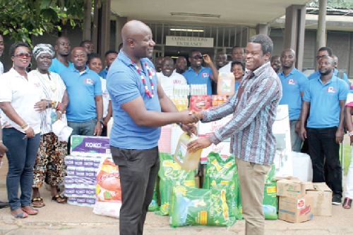  Dr Dickson Adomako Kissi (left), the Chairman of the Professionals for Political Actions (PPA), presenting the items to Mr Francis Lunguniah (right), the Head of Administration, Tetteh Quarshie Government Hospital. Picture: MAXWELL OCLOO