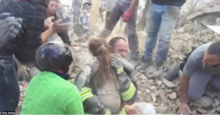 The child was pulled from under a metal girder before a fire fighter carried her down for medical treatment
