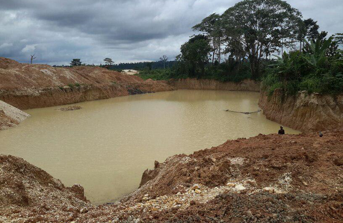  One of the abandoned pits breeding mosquitoes and posing danger to the farmers