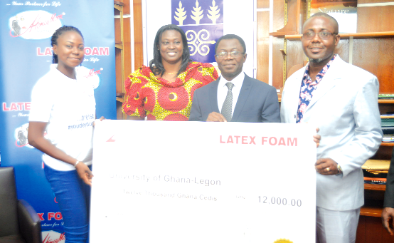 Ms Gifty Appiah presenting a dummy cheque  to Professor Kwame Offei 