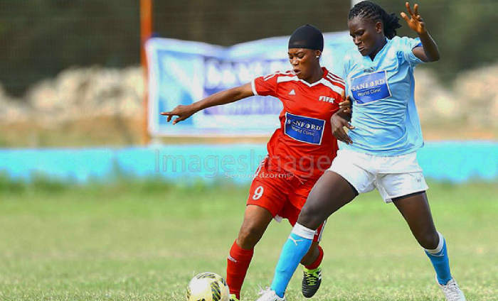  Immigration’s Agnes Quaye (left), slugs it out with Patience Kpobi of Police in their game yesterday. PICTURE: IMAGES IMAGE
