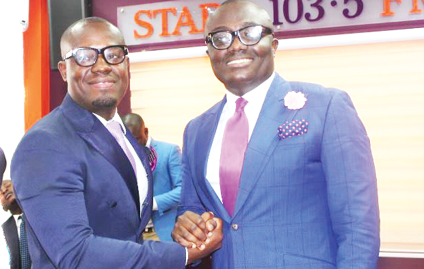 Bola Ray (right) hands over “power” to Giovani