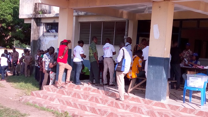 Some of the voters in a queue 