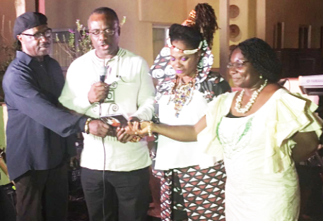 The actual launch moment with (from left) Gyedu Blay Ambolley, Akunu Dake, Della Hayes and Diana Hopeson