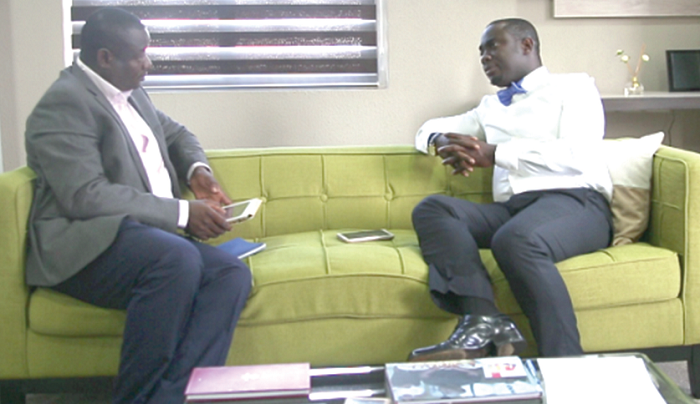  Mr Mike Nyinaku (right), CEO, BEIGE Group, speaking to Mr Samuuel Doe Ablodeppey of the Graphic Group