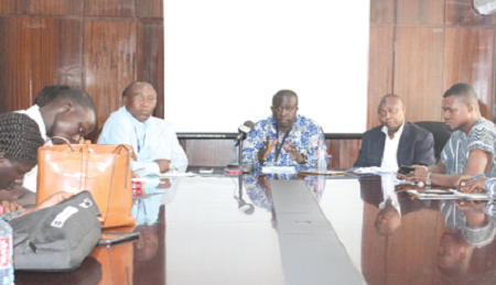 Dr Toni Aubyn (3rd left), C E O, Minerals Commission, briefing the press on the relocation exercise of the informal miners