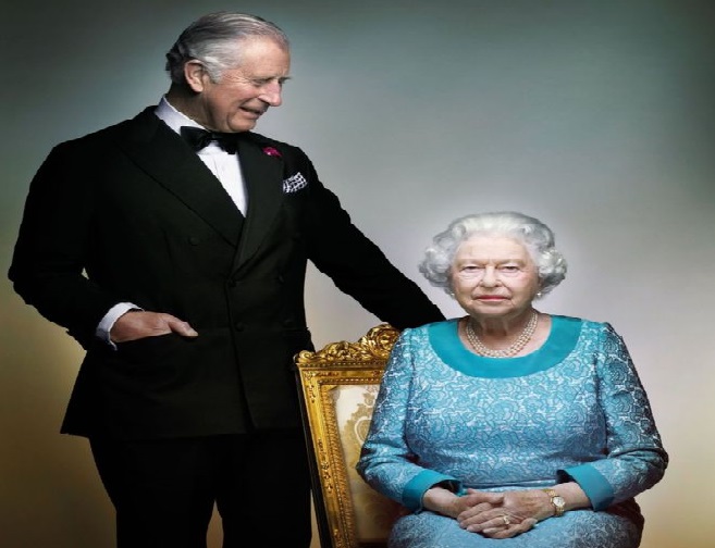 In the photo, Prince Charles appears to smile at the Queen, who looks directly at the camera