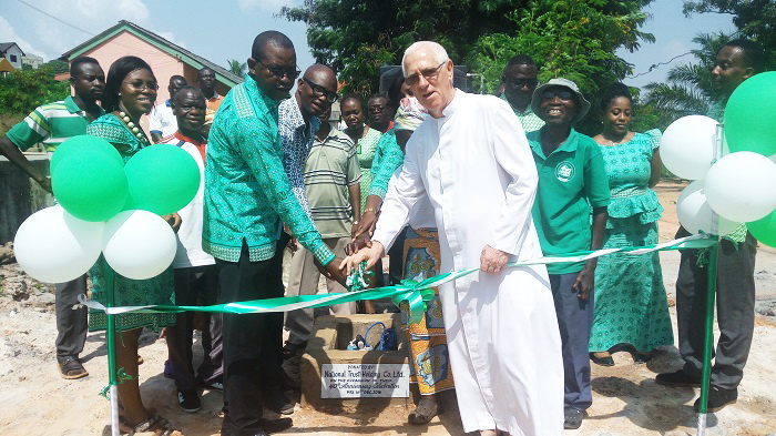 Rev. Fr Campbell (right) and Mr Francis Apanka inaugurating the borehole