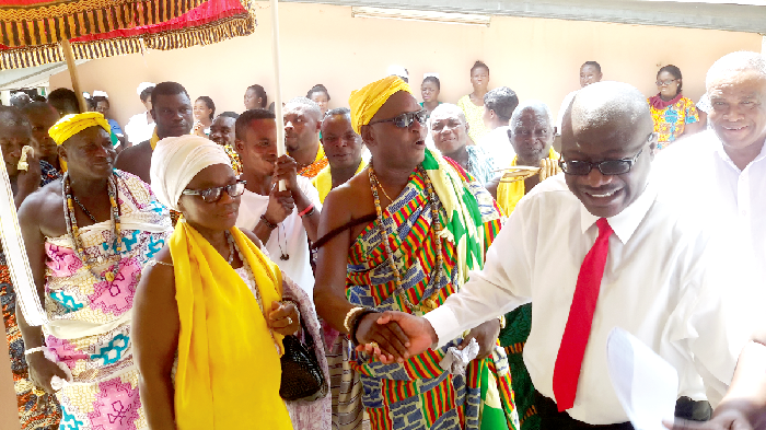 Dr Patrick Amo-Mensah (right) leading Nii Ashalley into the new ward
