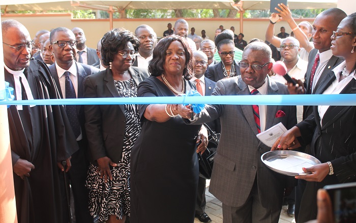 Mrs Justice Georgina T. Wood (3rd right) being assisted by Ambassador James Victor Gbeho (2nd right),  to cut a tape to inaugurate the new Liberty Court. With them are some officials of the Judicial Service. Picture: EDNA ADU-SERWAA