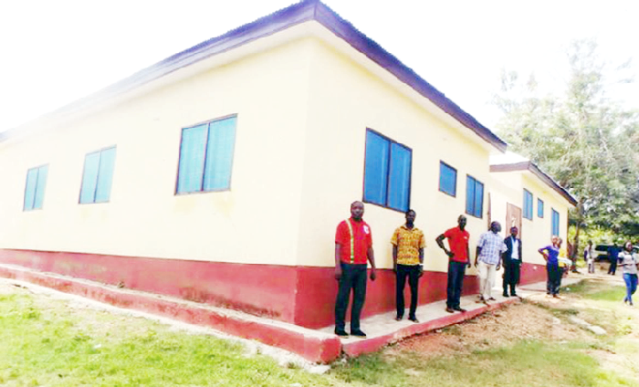 Mr Emmanuel Kwakye (left) leading media practitioners to inspect a bungalow accommodating four teachers of the Akyem Swedru Islamic Primary and Junior High Schools. PICTURE: SAMUEL KYEI-BOATENG 