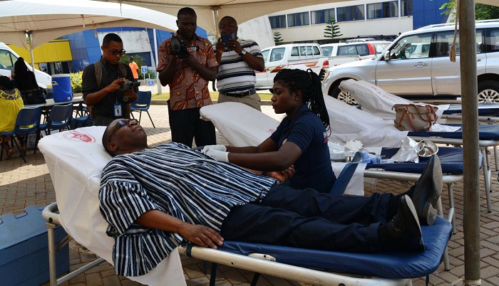 Mr Hudu Mogtari, CEO of FDA, being assisted by an official of the National Blood Service to donate blood. Picture: DELLA RUSSEL OCLOO