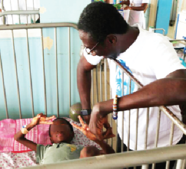 KSM interacting with one of the children